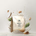 MyProtein Impact Diet Whey protein powder bag with coconut pieces and green leaves on a white background